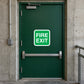 Green fire exit sticker with white text reading “FIRE EXIT” in a rounded rectangle