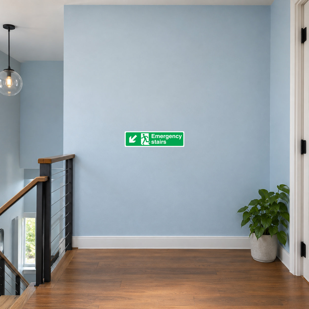 Green emergency stairs sticker with white text and running figure icon