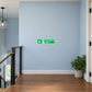 Green emergency stairs sticker with white text and running figure icon