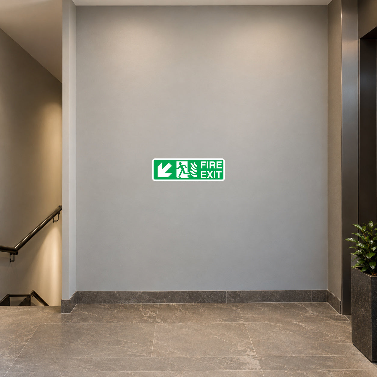 Green fire exit down arrow sticker with running figure and "FIRE EXIT" text
