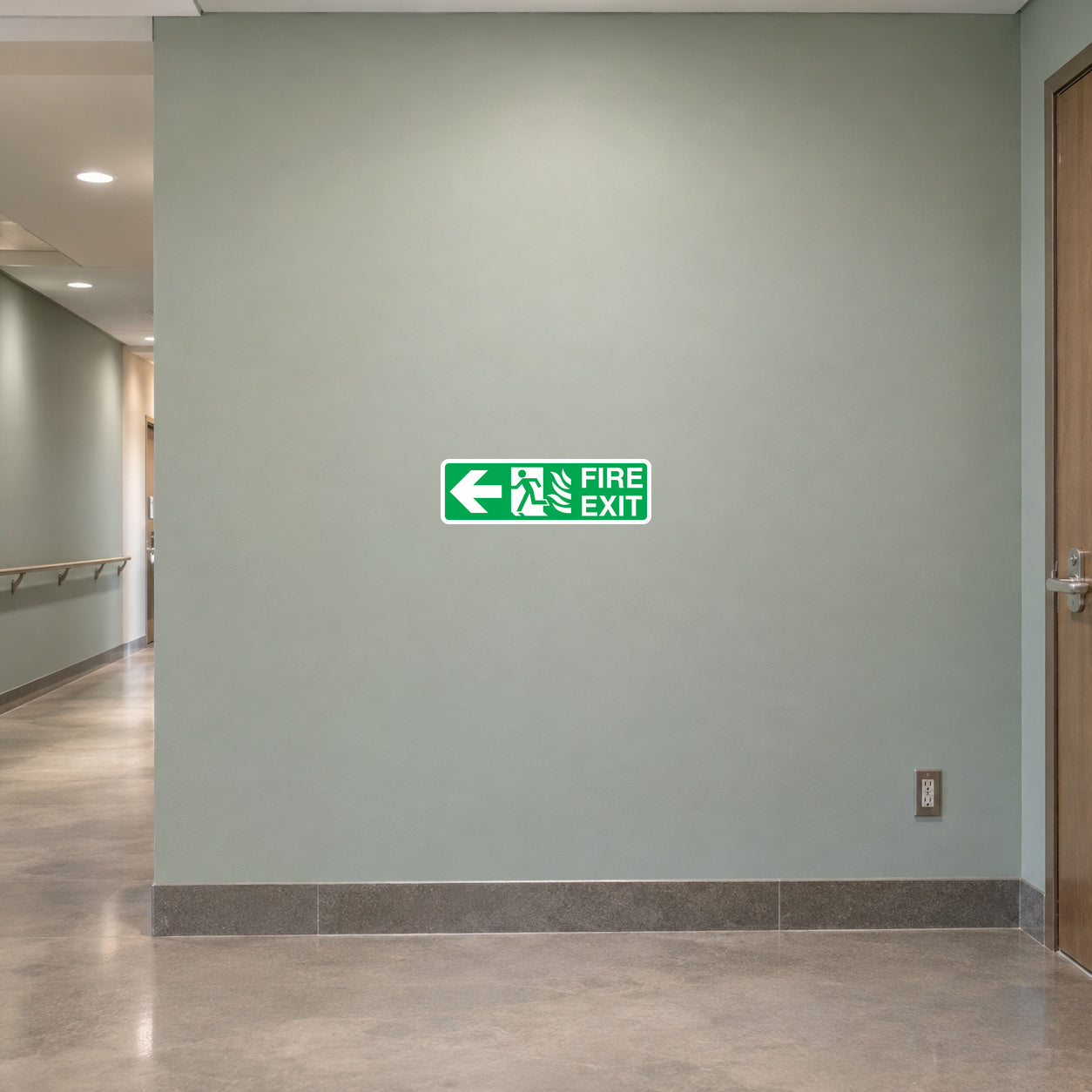 Green fire exit sticker with arrow and running figure, text FIRE EXIT