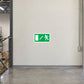 Emergency exit down arrow sticker sign, green and white with running figure icon