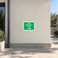 Fire assembly point wayfinding sticker with green label, text, and right arrow