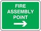 Fire assembly point safety sticker, green with white text and right arrow