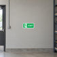 Green exit sign sticker with running figure and EXIT text