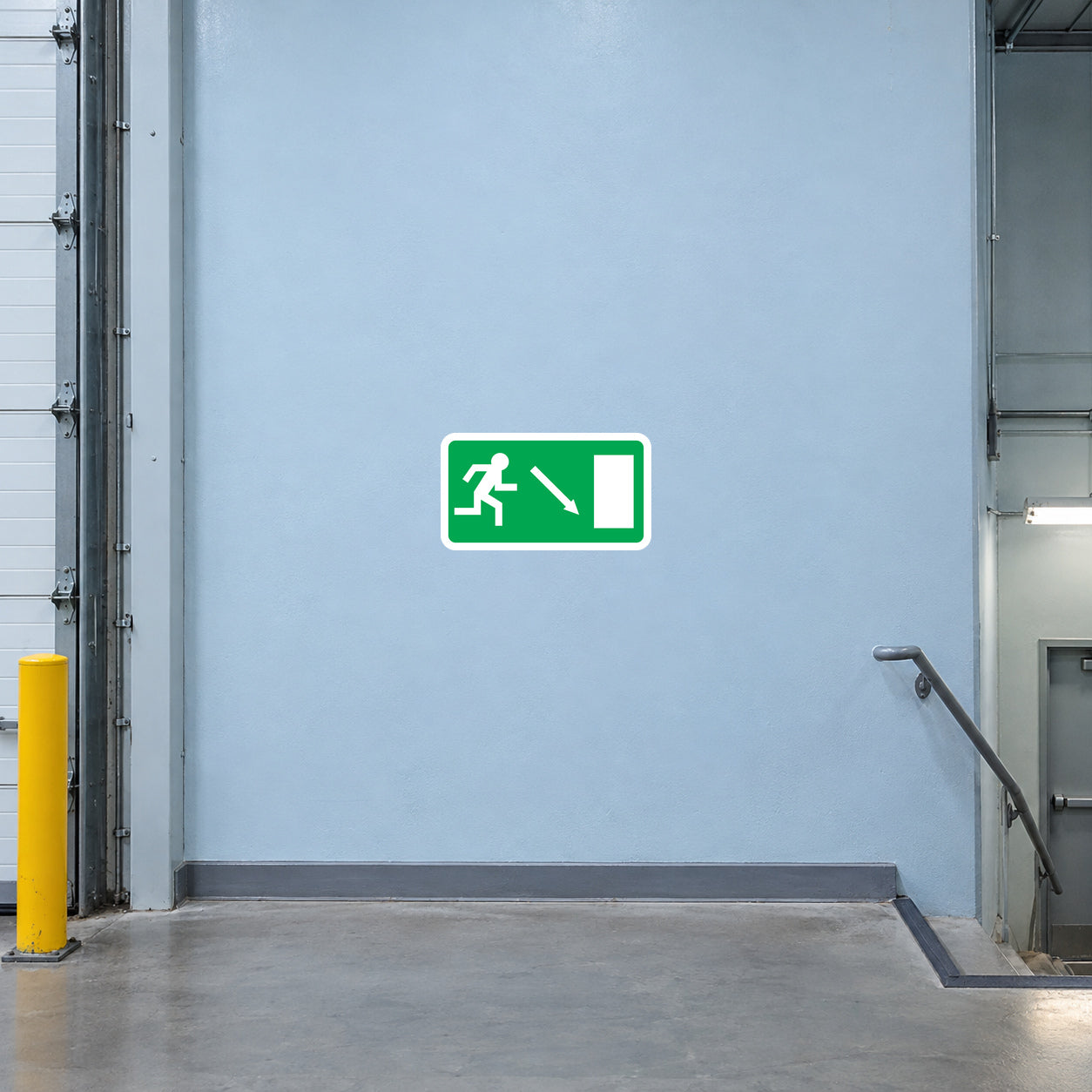 Emergency exit downstairs safety door sticker with green walking figure and arrow