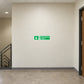 Emergency stairs down sticker, green sign with white arrow and text