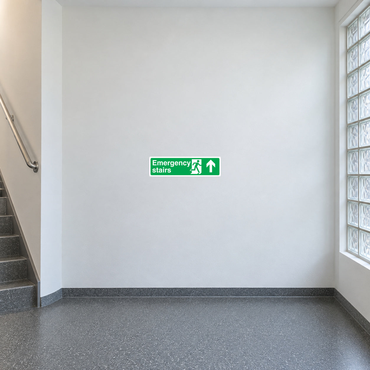 Emergency stairs up safety sticker, green sign with white arrow and running figure