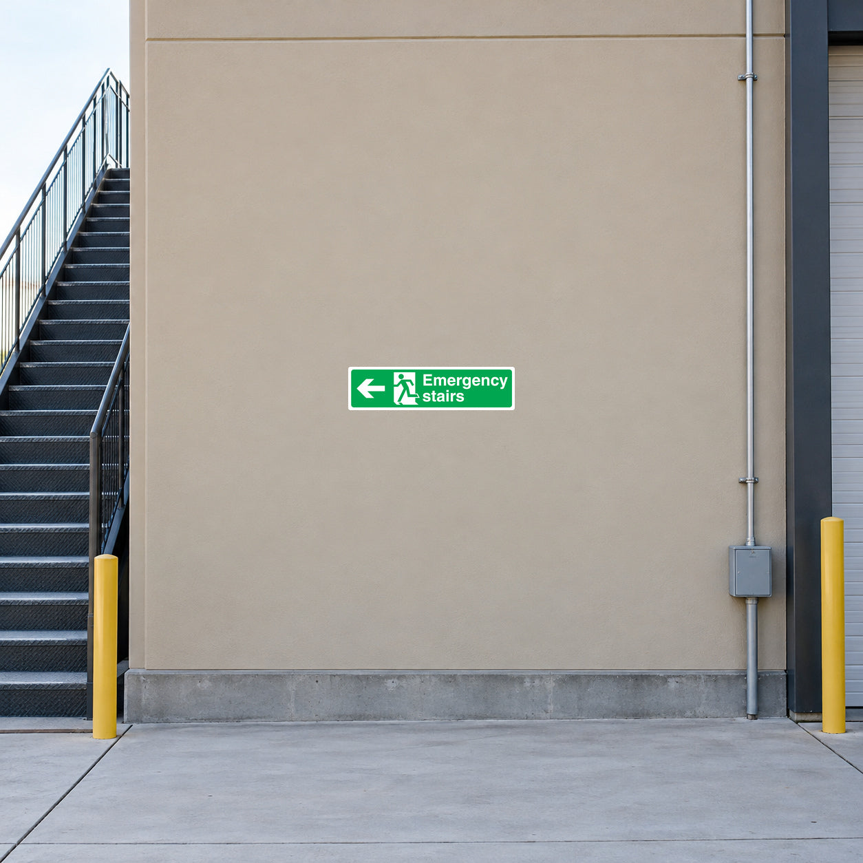 Emergency stairs left directional sticker with green arrow and safety icon