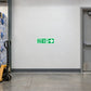 Green FIRE EXIT sticker with right arrow and running person
