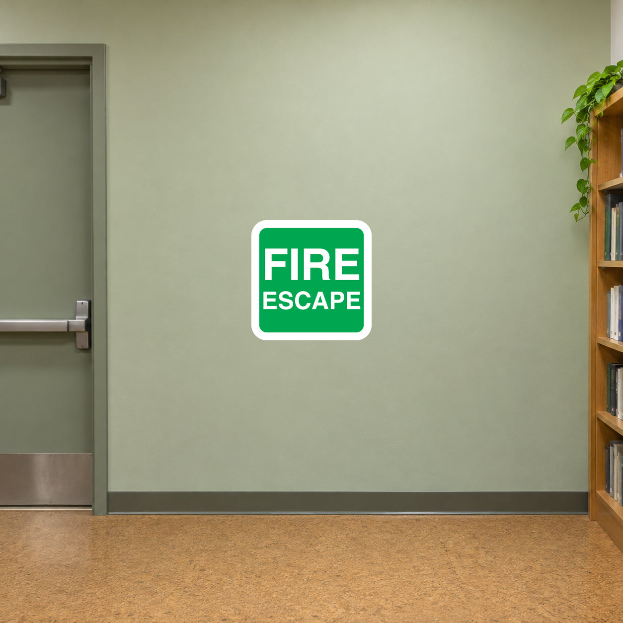 Fire escape sticker with green square border and white text reading FIRE ESCAPE