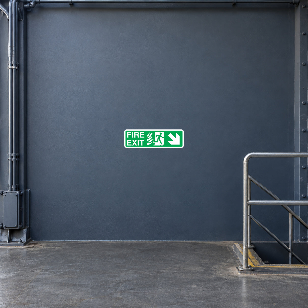 Green fire exit down sticker with running figure and arrow