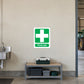 First aid sticker with green cross and “First aid” text on white background