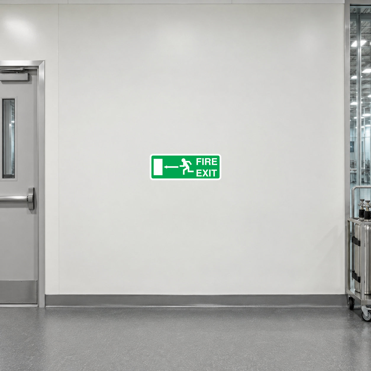 Green Fire Exit sticker with left arrow and running figure pictogram