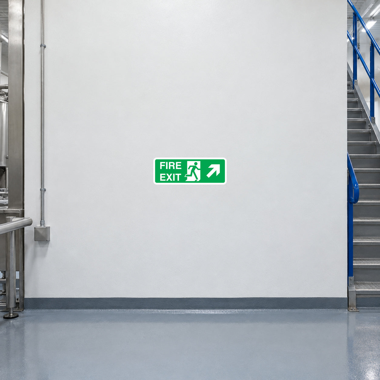 Green fire exit sign sticker with running person and arrow for emergency escape