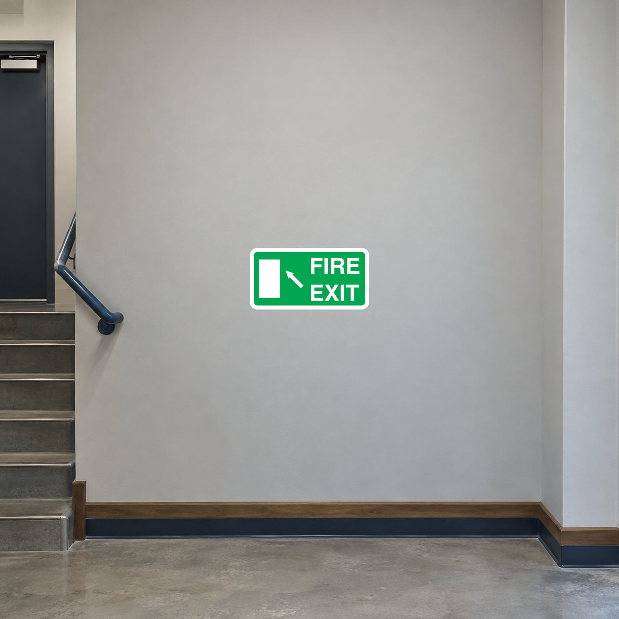 Green rounded-rectangle fire exit safety sticker with left arrow and running figure