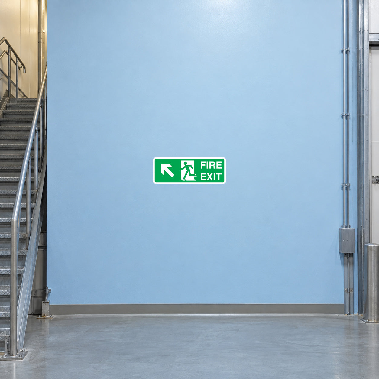 Green fire exit out sticker with running figure and EXIT text