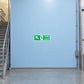 Green fire exit out sticker with running figure and EXIT text