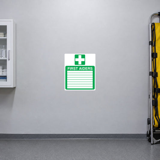 First Aiders sticker with green cross and lined first aid notice on white background