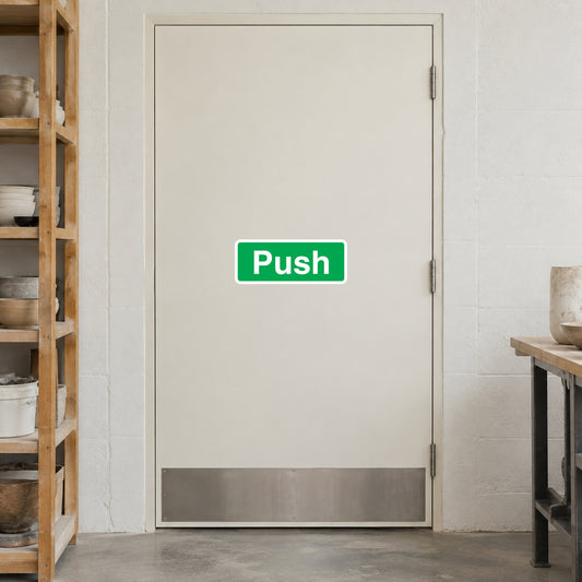 Green Push door safety sign sticker on a closed door