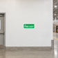 Fire exit sticker with green sign reading 'To FIRE EXIT'.