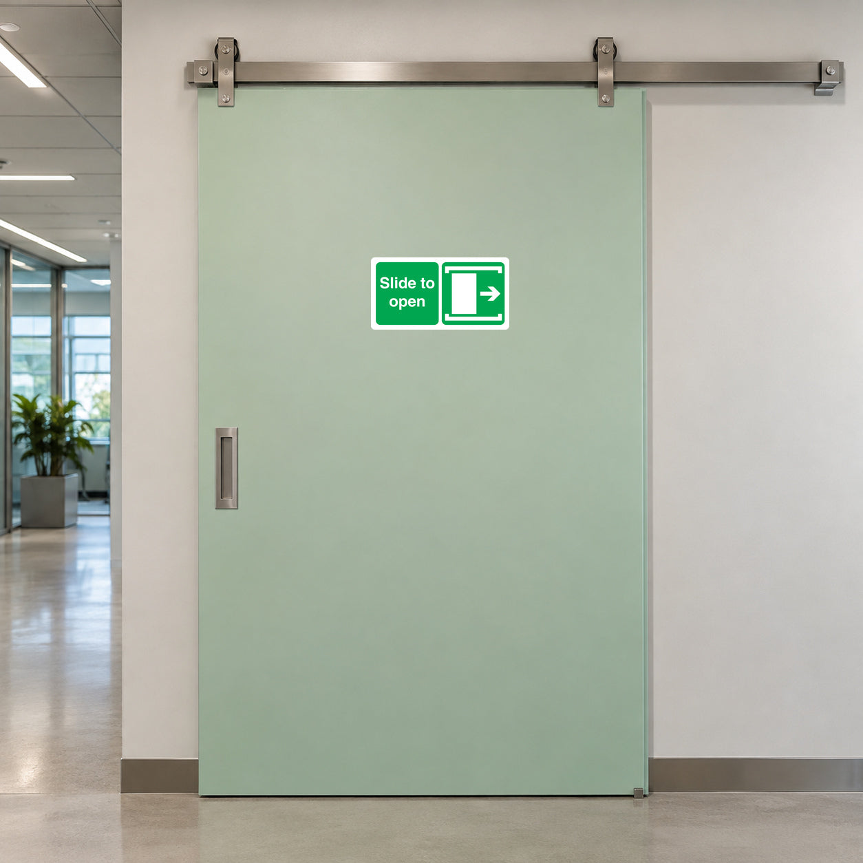 Slide to Open safety sticker on a commercial sliding door