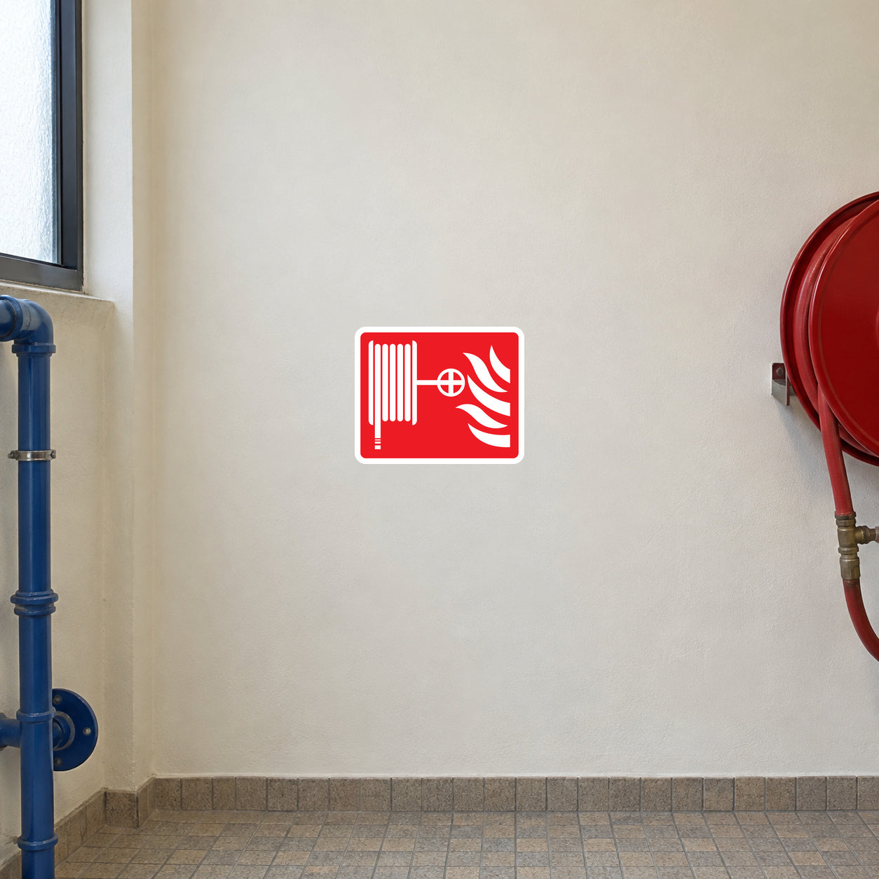 Red and white fire hose warning sticker with hose and gauge icon