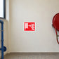 Red and white fire hose warning sticker with hose and gauge icon