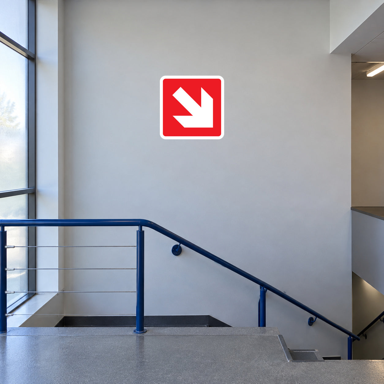 Fire exit down-right safety sticker with red border and white arrow