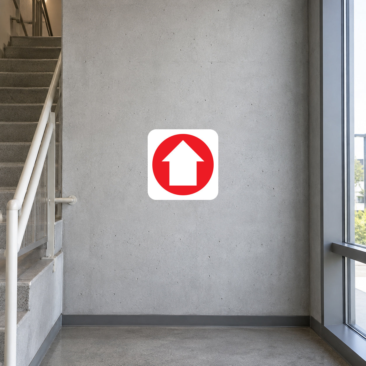 Fire exit upstairs sticker with red upward arrow inside a white rounded square