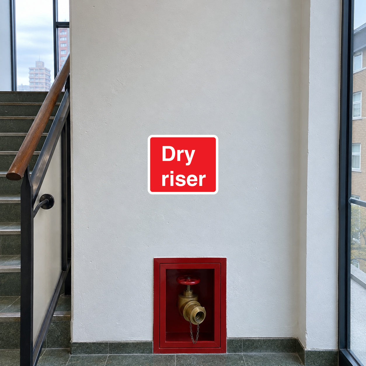 Red dry riser fire access sticker with 'Dry riser' text