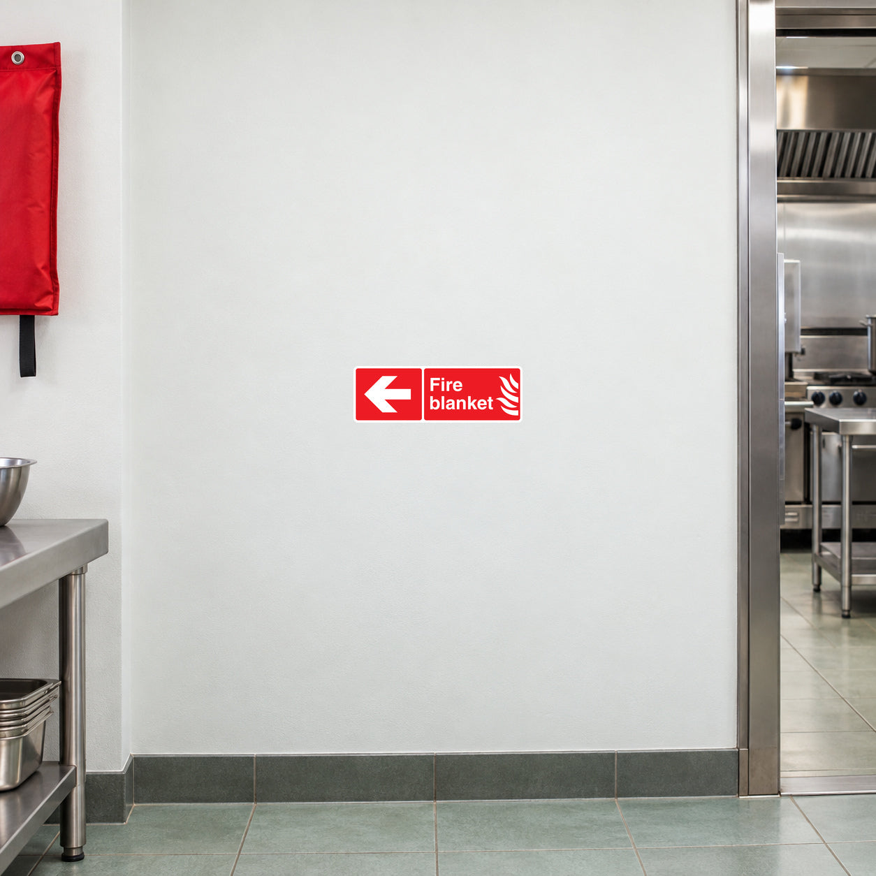 Red fire blanket directional wall sticker with left-pointing arrow and label text
