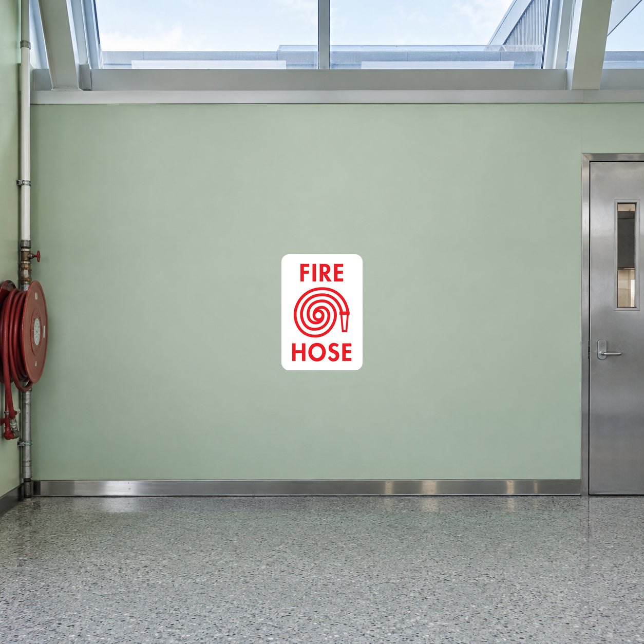 Fire hose here sticker with red circular hose symbol and FIRE HOSE text