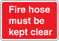 Red fire hose safety sticker with white “Fire hose must be kept clear” text