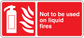 Red fire safety sticker with extinguisher icon and warning text: Not to be used on liquid fires
