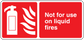 Red safety sticker with fire extinguisher icon and text "Not for use on liquid fires"