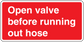 Red hose valve sticker reading 'Open valve before running out hose'