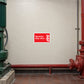 Sprinkler stop valve warning sticker, red rectangle with white text and flame icon