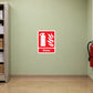 Water Fire Extinguisher Sticker applied in a printing company paper archive fire station, smooth pale green wall, red water extinguisher far lower right, closed unlabelled paper storage cabinet edge left, tan epoxy floor