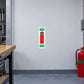Vaporouising Liquids Fire Extinguisher Sticker applied in a fire-service college equipment demonstration workshop, smooth pale gray wall, unlabelled red demonstration extinguisher with green band far lower right, wooden workbench edge left, blue-gray concrete floor
