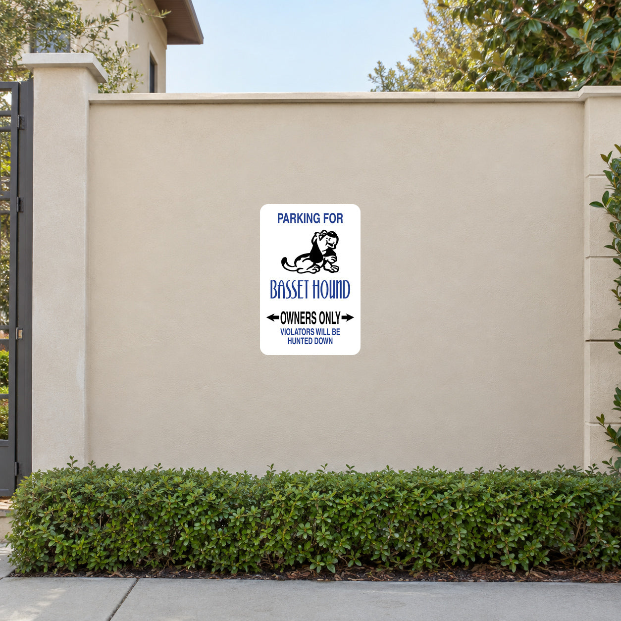 Parking For Basset Hound Owners Only Fun Sign Sticker applied to a beige garden boundary wall