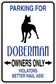 Doberman owners only parking sign sticker with black dog silhouette and blue text on white