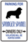 Dog parking sign sticker with blue text: PARKING FOR, OWNERS ONLY, violators hunted down
