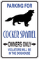 Cocker Spaniel parking sign sticker with black dog silhouette and blue warning text.