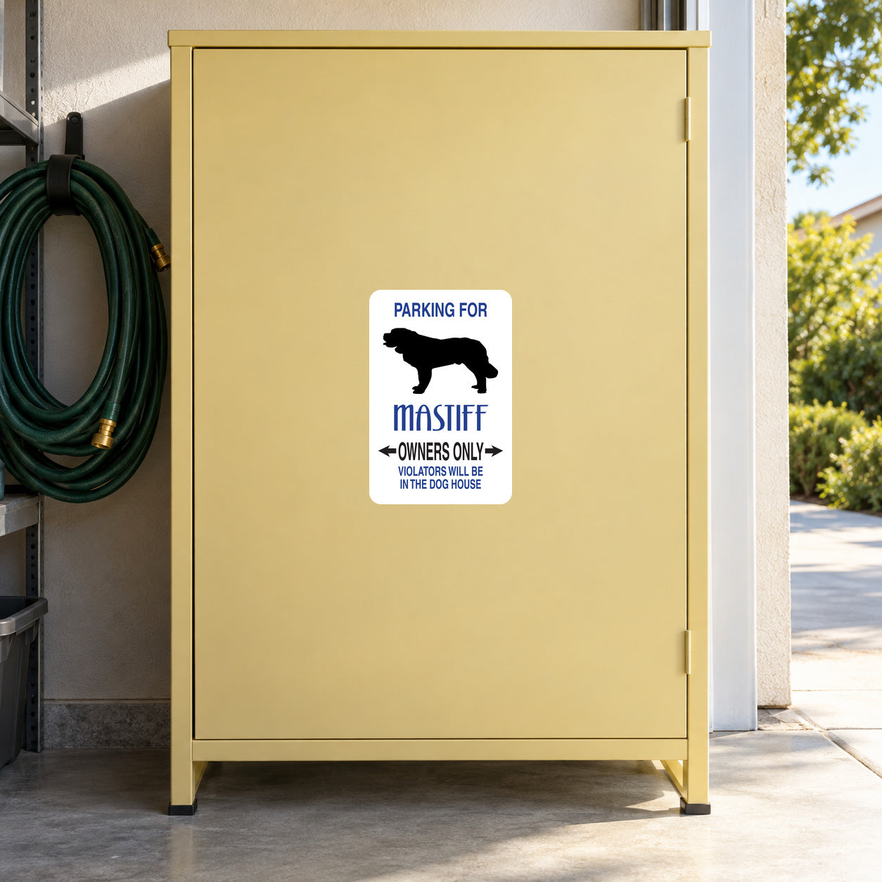 Parking For Mastiff Owners Only Fun Sign Sticker applied to a pale yellow private garage cabinet
