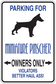 Miniature Pinscher parking sign sticker with blue text and dog silhouette, owners only