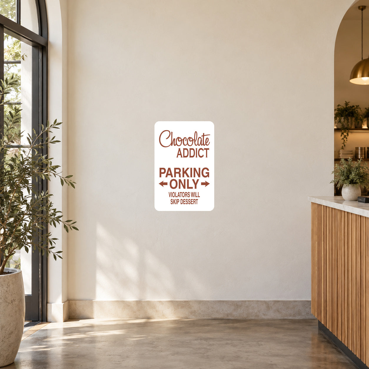 CHocolate Addict Parking Only Sticker applied to a cream cafe entrance wall