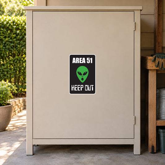 Area 51 keep out sticker with green alien face and black warning text