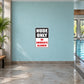 Rectangular sticker sign: NUDE ONLY; NO SWIMSUITS ALLOWED!