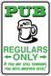 Beer sign sticker with green text “PUB REGULARS ONLY” and beer mug graphic